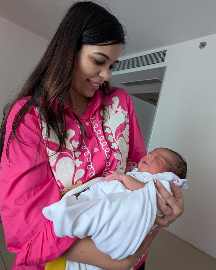 A mother holding her newborn